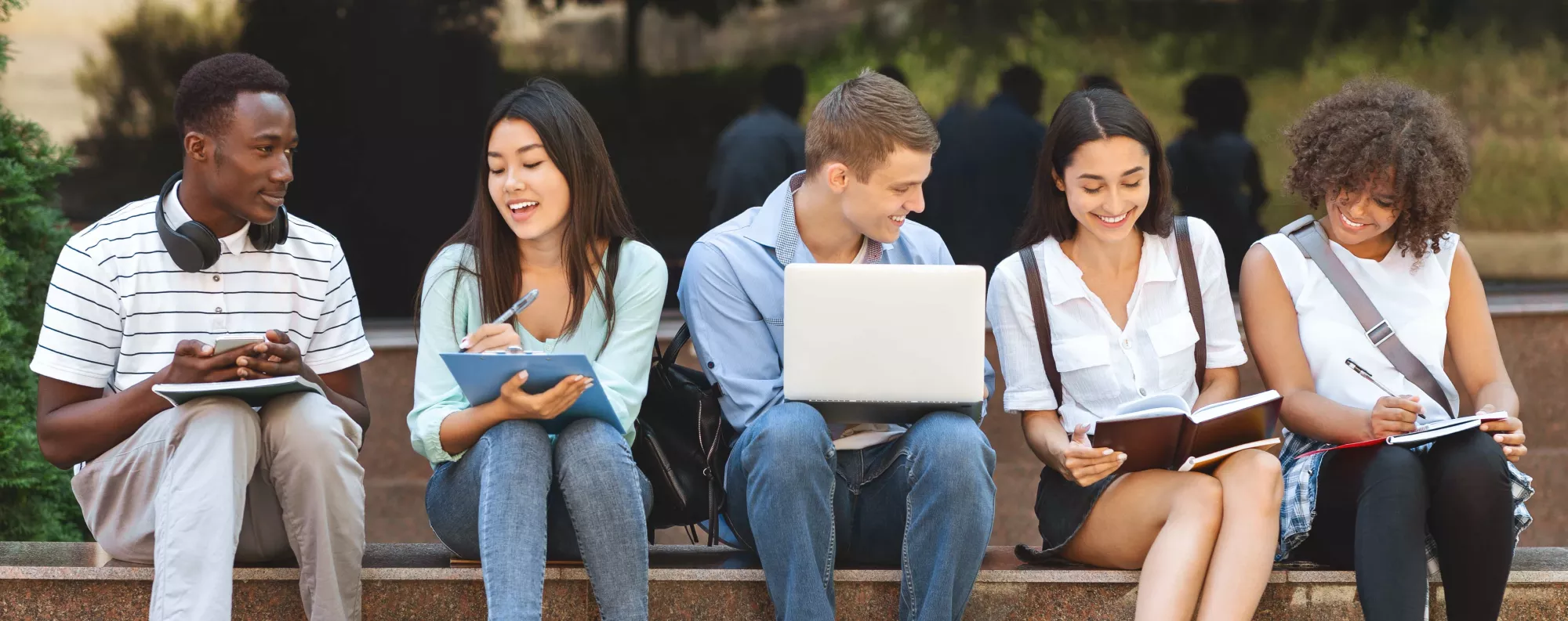 Students reading their textbooks.