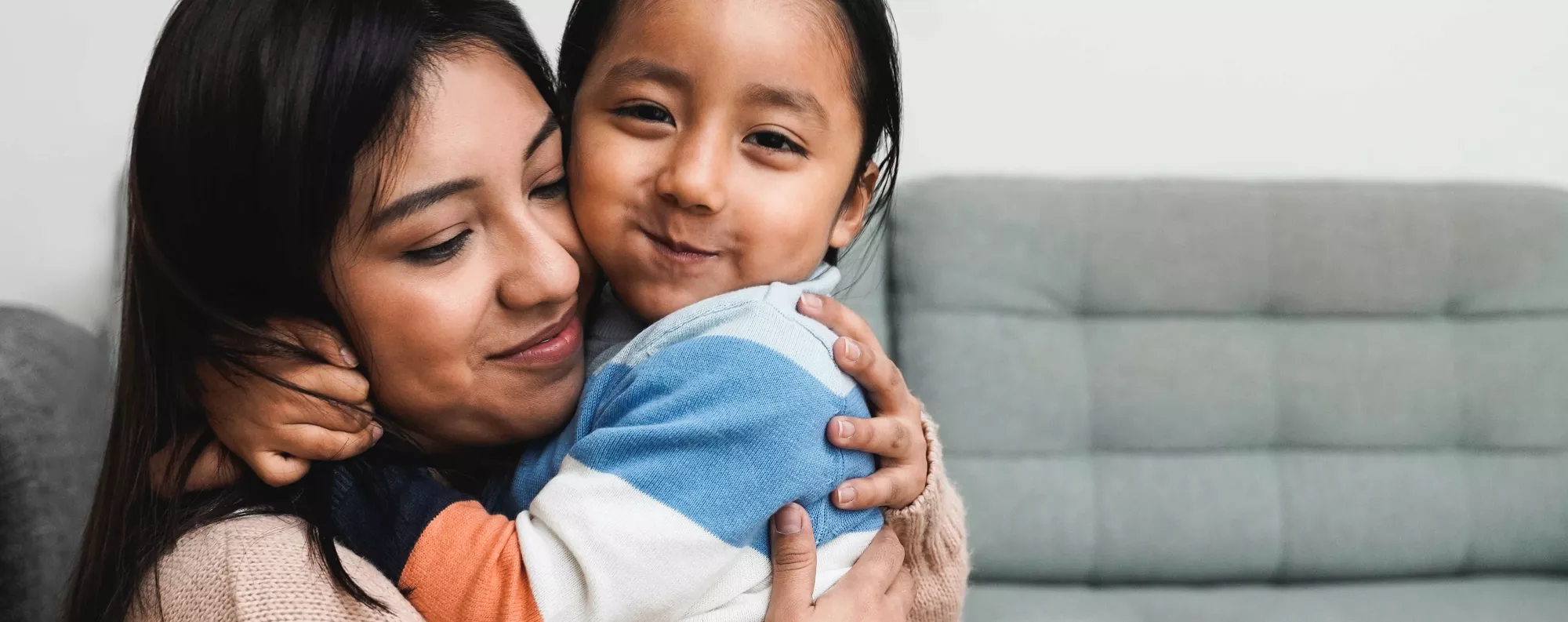 Woman holding child.