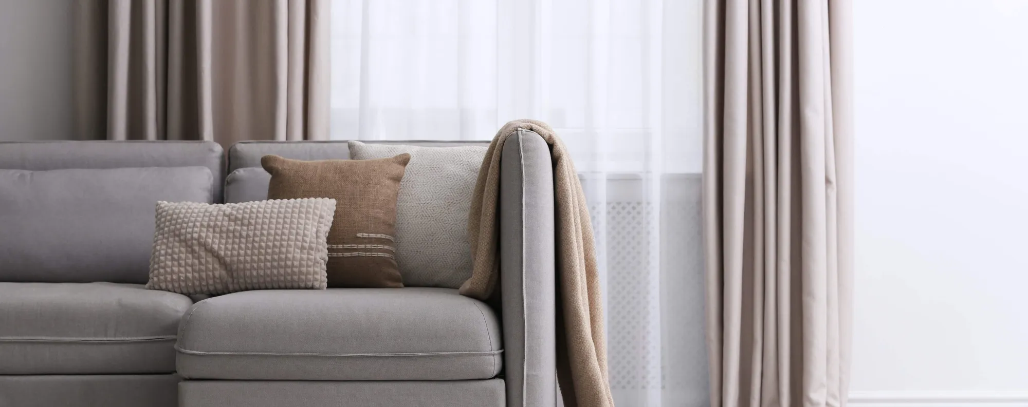 Beige couch in a living room.