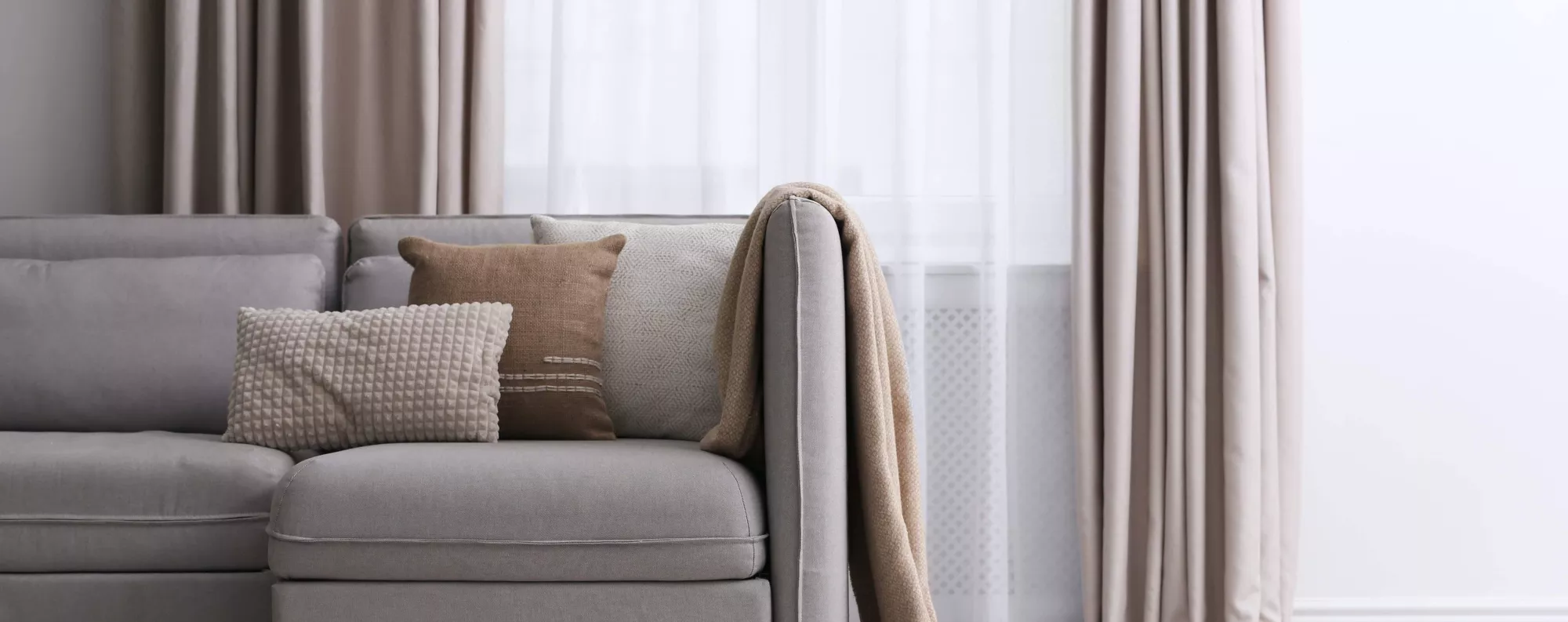 Beige couch in a living room.