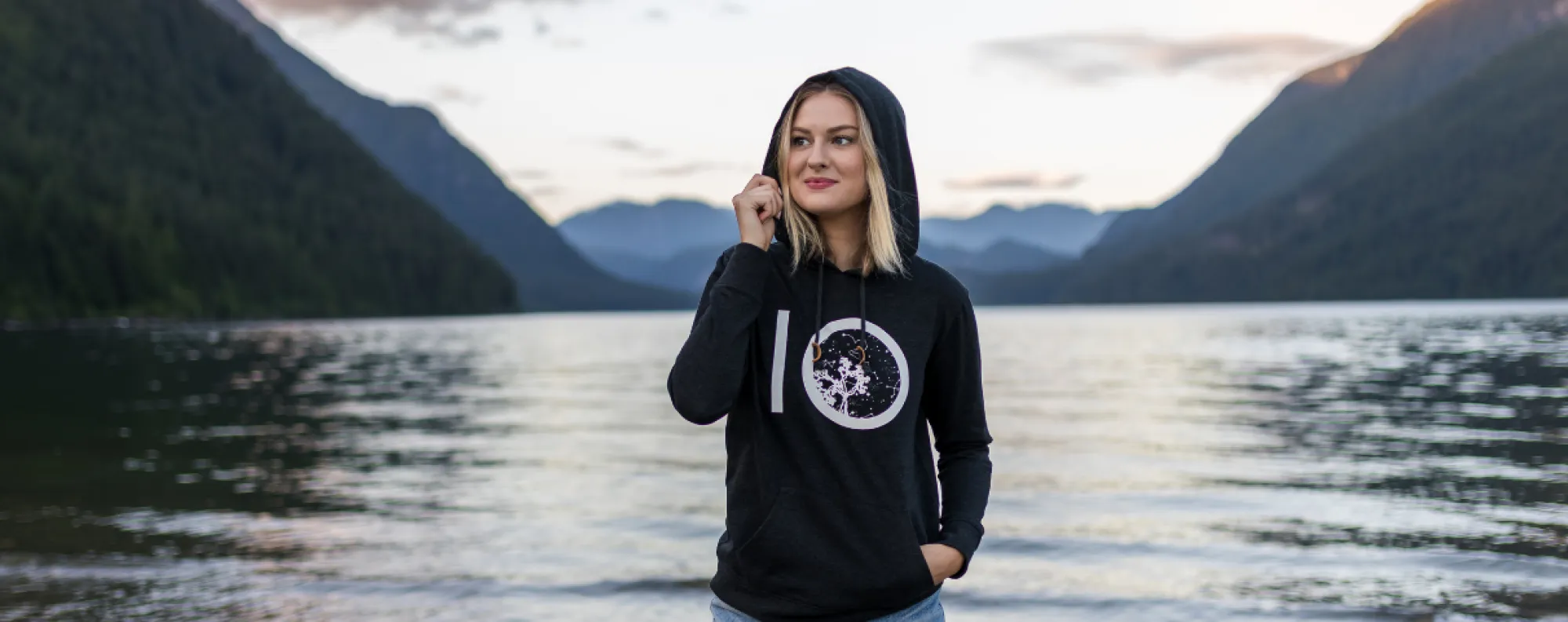 Tentree sweater model with lake background