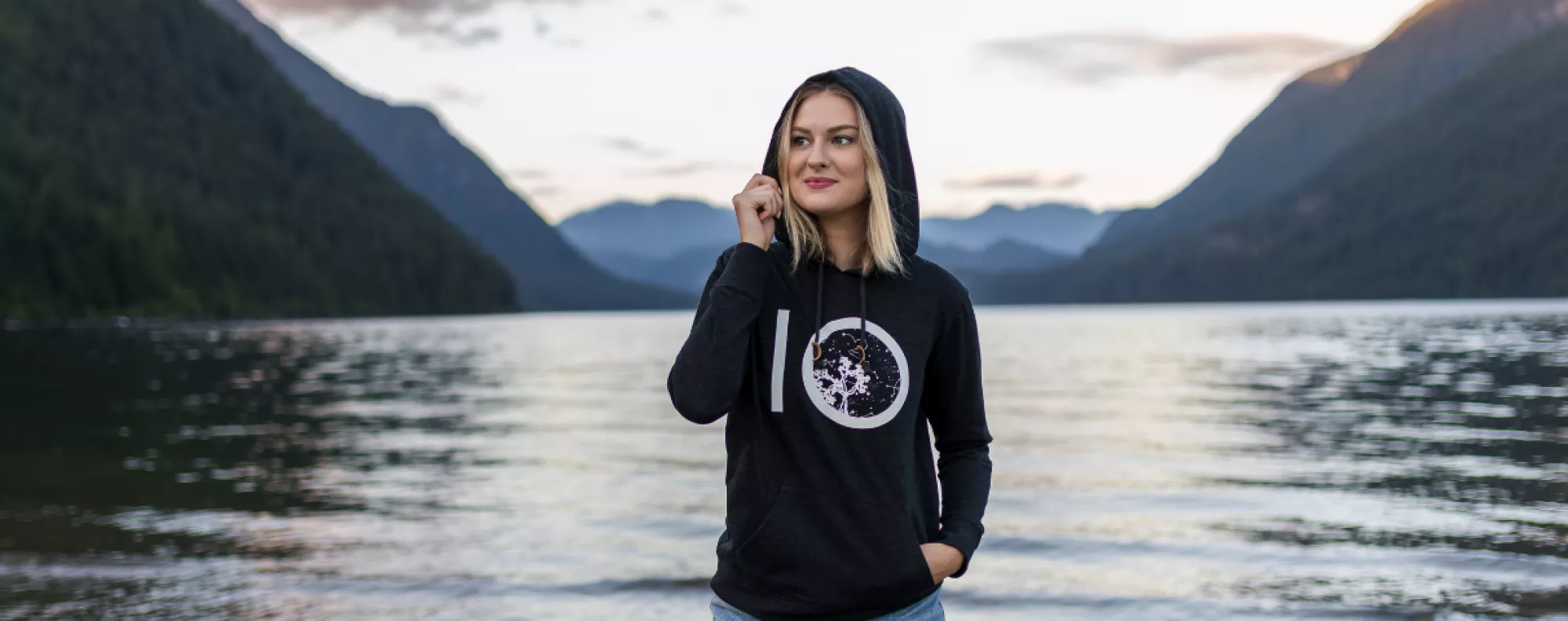 Tentree sweater model with lake background