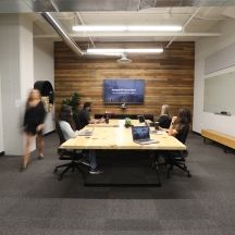 Team meeting in boardroom.