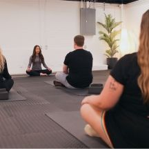 Team doing meditation in wellness room