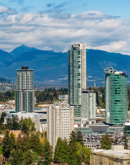 City of Surrey skyscrapers with mountain range behind