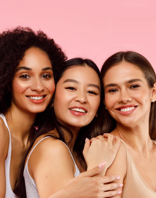 Three women posing for photo with BBI logo on the top right corner